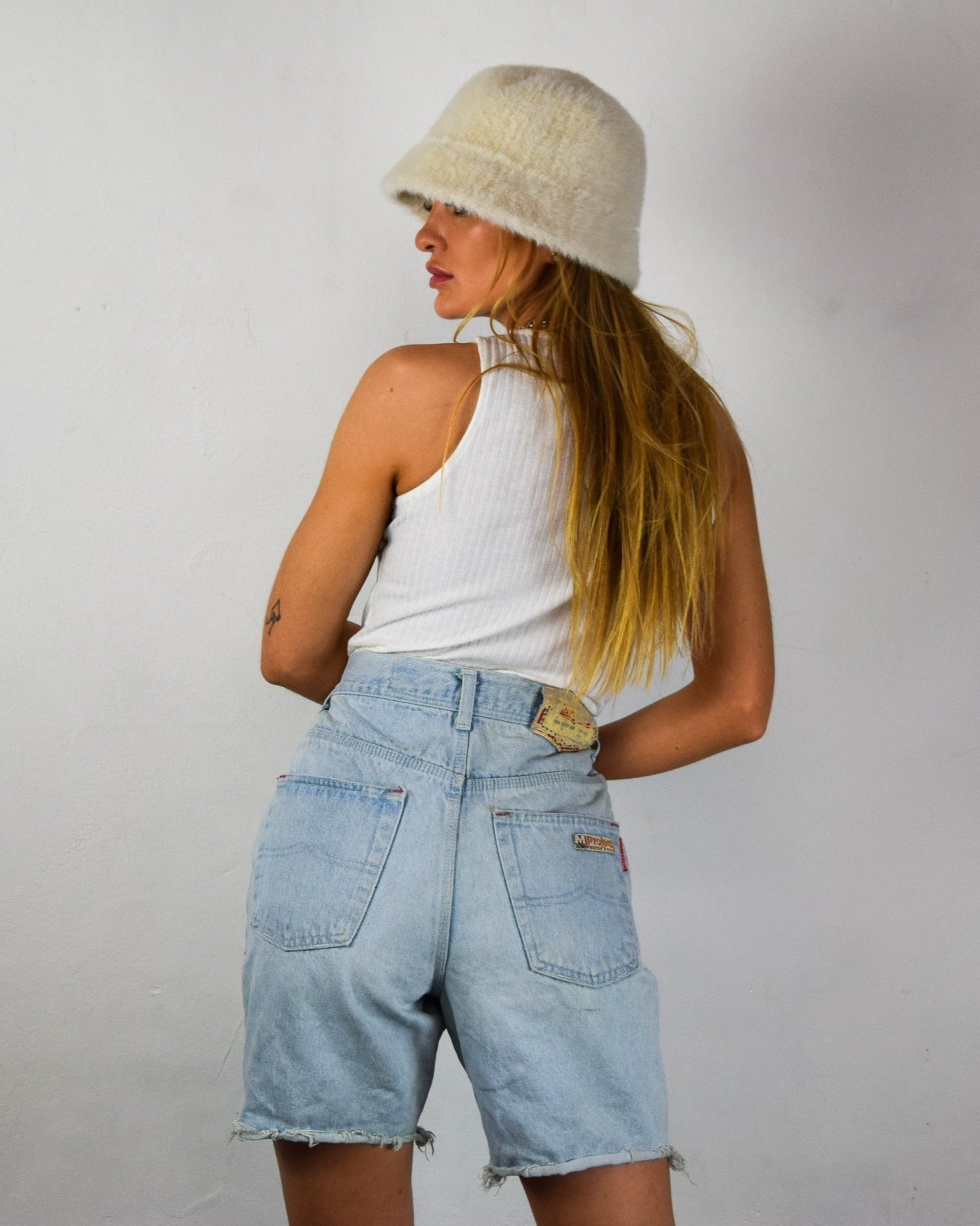 Female wearing denim shorts